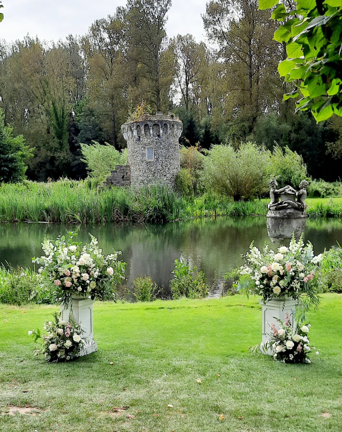 Outdoor wedding ceremony flowers at Oxnead Hall Norfolk