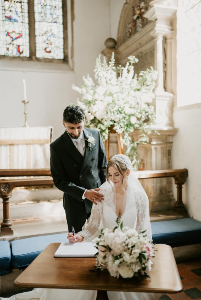 Emma and Jay at East Harling Church in Norfolk. Blush and white Bridal bouquet and church flowers.