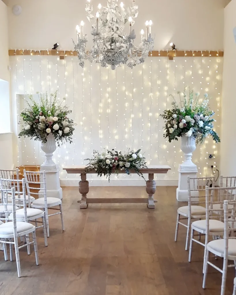 Floral urns filled with elegant florals at Shotesham Park wedding venue Norfolk 