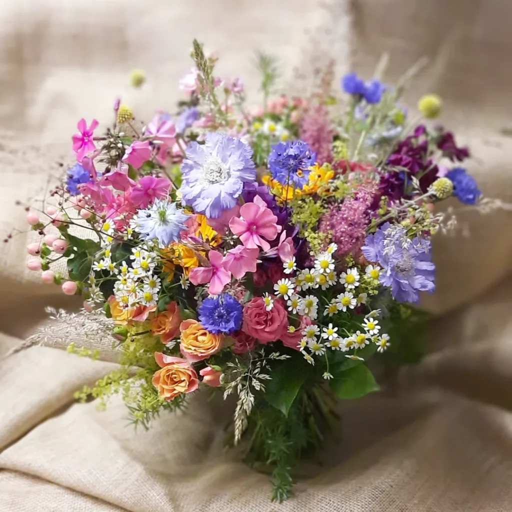 Pretty colourful bridal bouquet featuring mixed colourful natural florals
