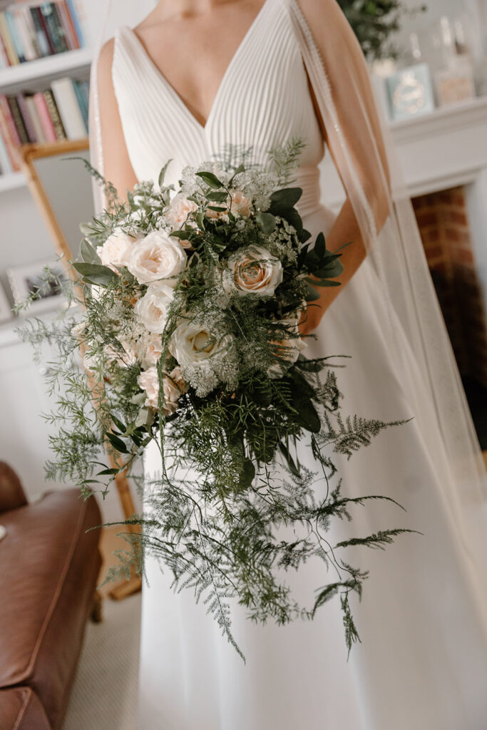 Blush pink and white cascading bouquet with natural foliage including David Austin Roses.