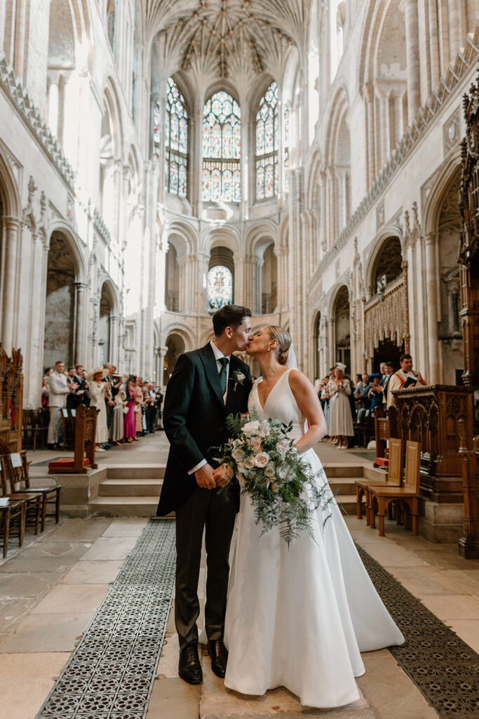 Wedding at Norwich Cathedral for Hattie and Leo. Cascading blush and white bridal bouquet