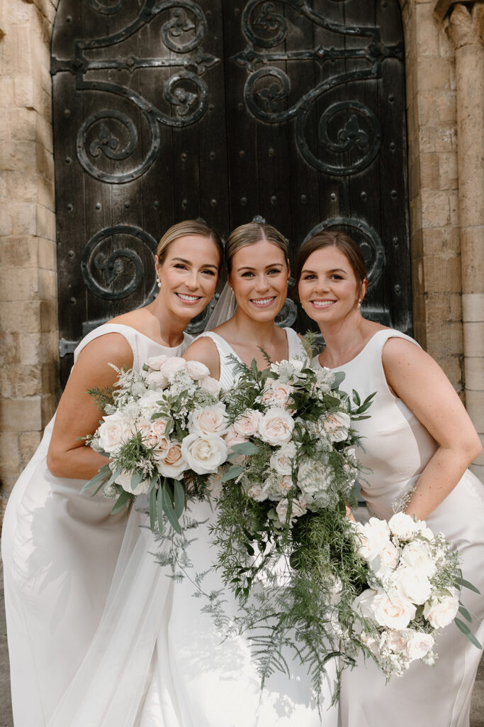 Wedding at Norwich Cathedral for Hattie. Natural cascading bridal bouquet and bridesmaids bouquets in blush and white