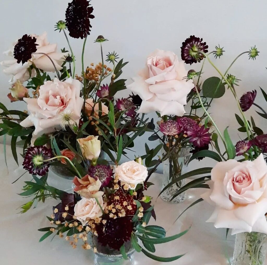 Tabke florals in shades of burgundy, coffee and blush tones.