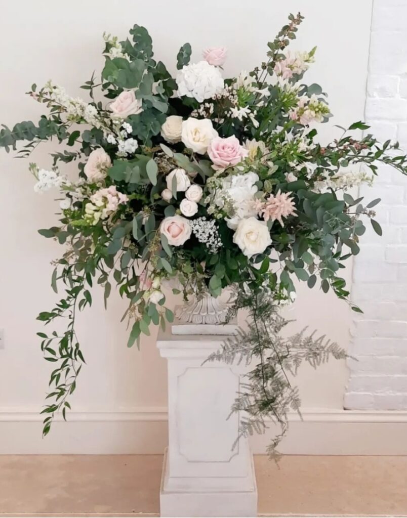 Floral urn in shades of blush and white at Shotesham Park wedding venue Norfolk 