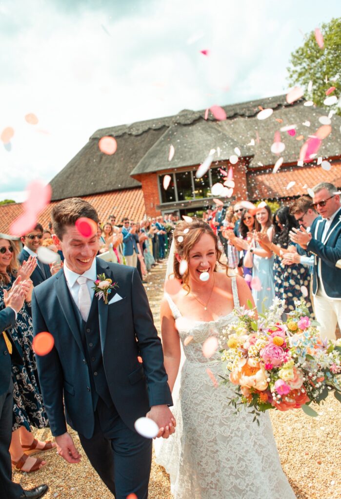 Bridal bouquet with mixed colourful natural flowers for Katie at The Woodyard Worstead Estate wedding venue Norfolk