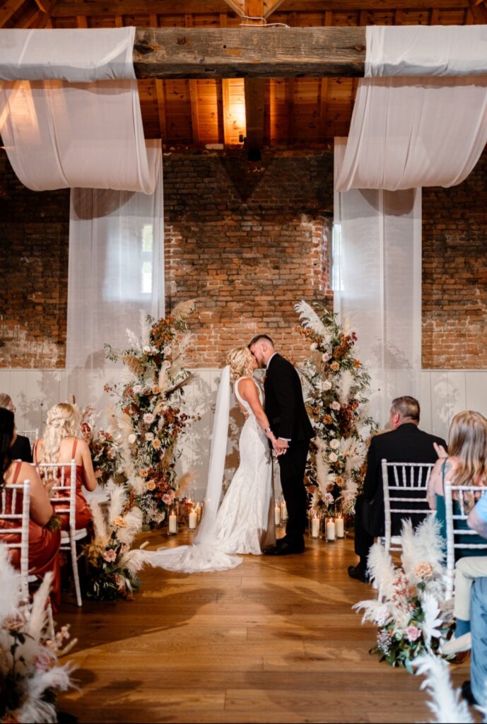 Fresh and dried flower deconstructed arch for a wedding ceremony at The Woodyard Worstead Estate wedding venue Norfolk 