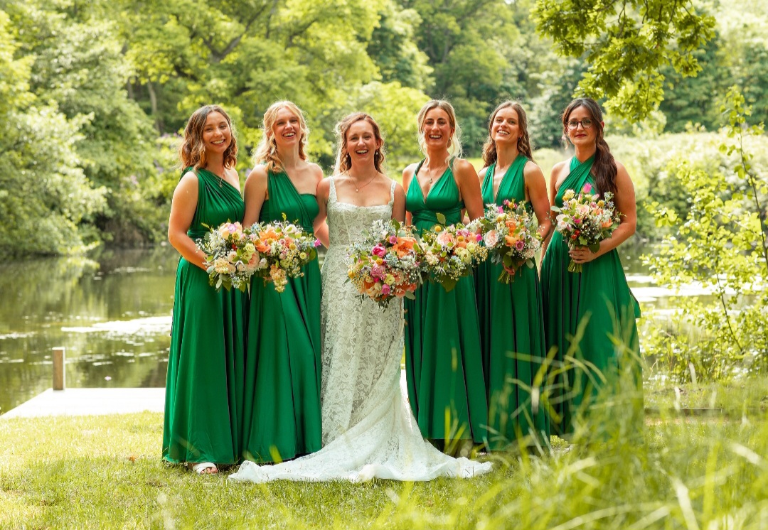 Katie and her bridesmaids at The Woodyard Worstead Estate wedding venue in Norfolk. Featuring colourful natural bridal and bridesmaids bouquets