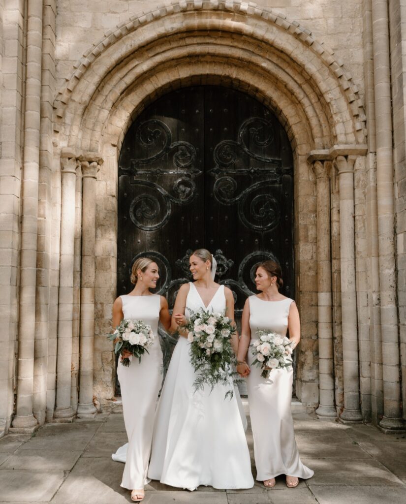 Blush pink and white cascading bridal bouquet and bridesmaids bouquets at Norwich Cathedral 
