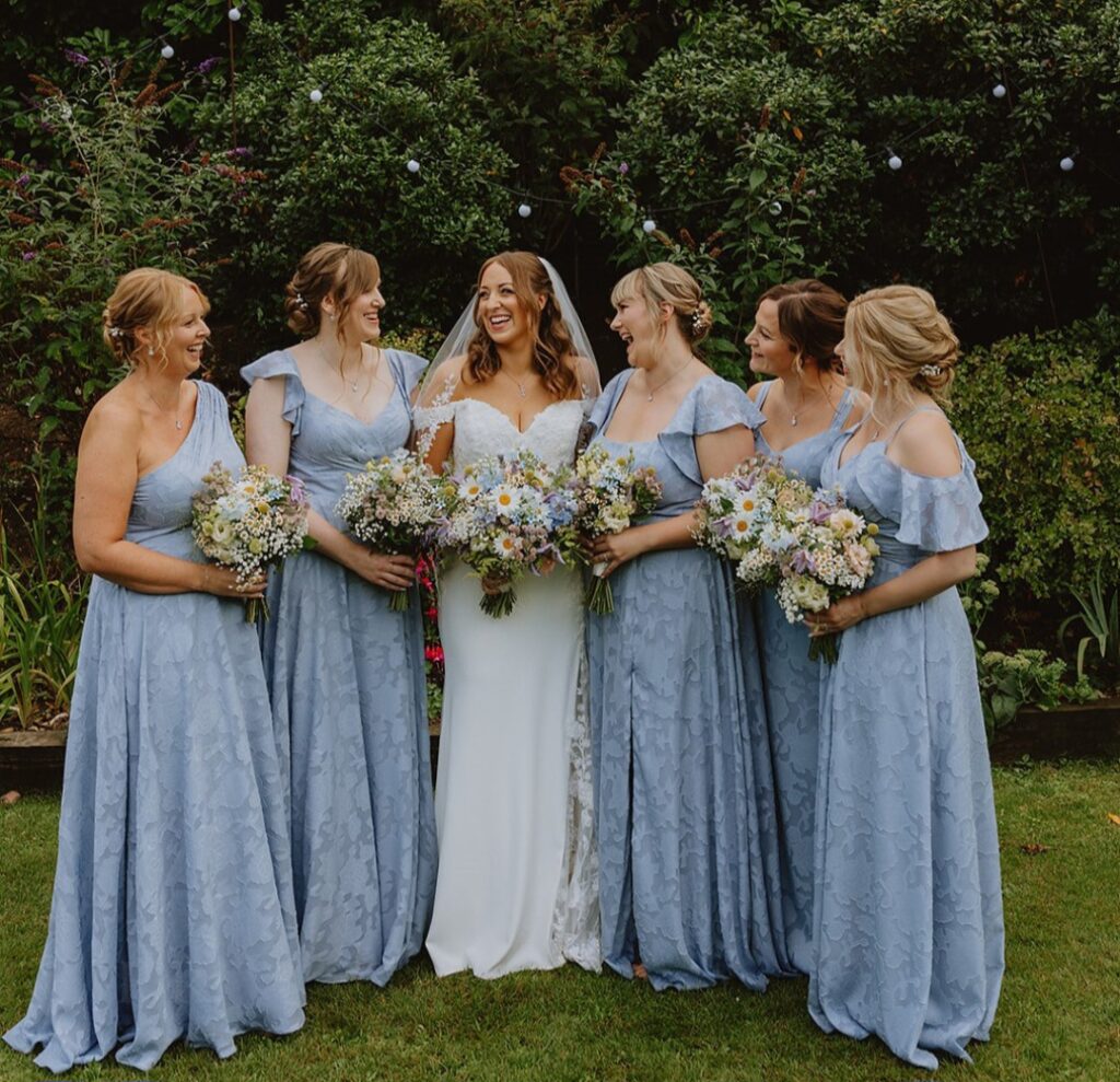 Wedding bouquets with dainty meadow style flowers in pastel shades for Sarah at Manor Mews wedding venue