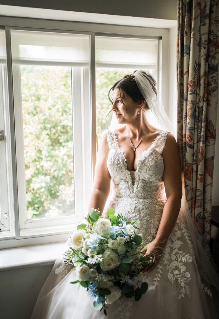 Philippa and James at The Hoste Arms in Burnham Market. Pale blue and white natural bridal bouquet