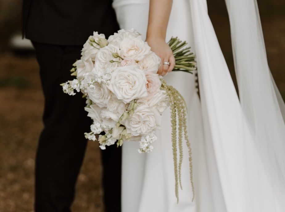 Modern bridal bouquet including blousy roses and trailing amaranthus at The Norfolk Mead Hotel