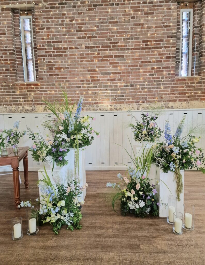 Natural pastel coloured ceremony flowers at Manor Mews wedding venue 