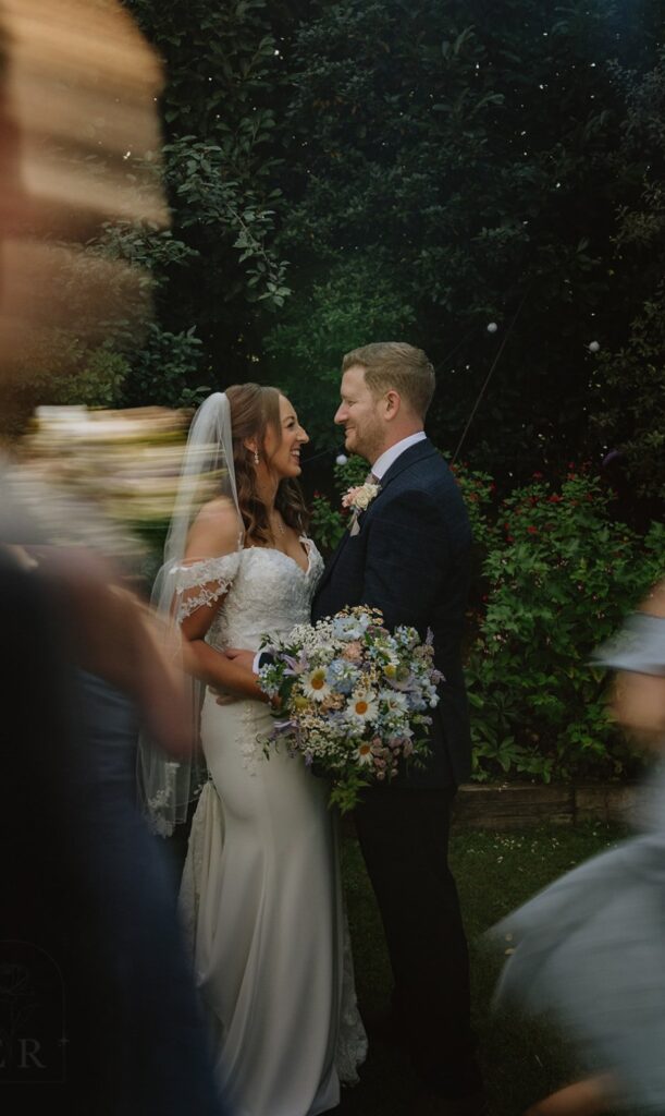 Sarah and Toms wedding at Manor Mews wedding venue. Meadow style bridal bouquet with dainty flowers in pastel shades