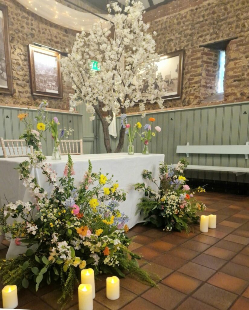 Ceremony flowers at Thursford Pavillion for Charmaine and Darren